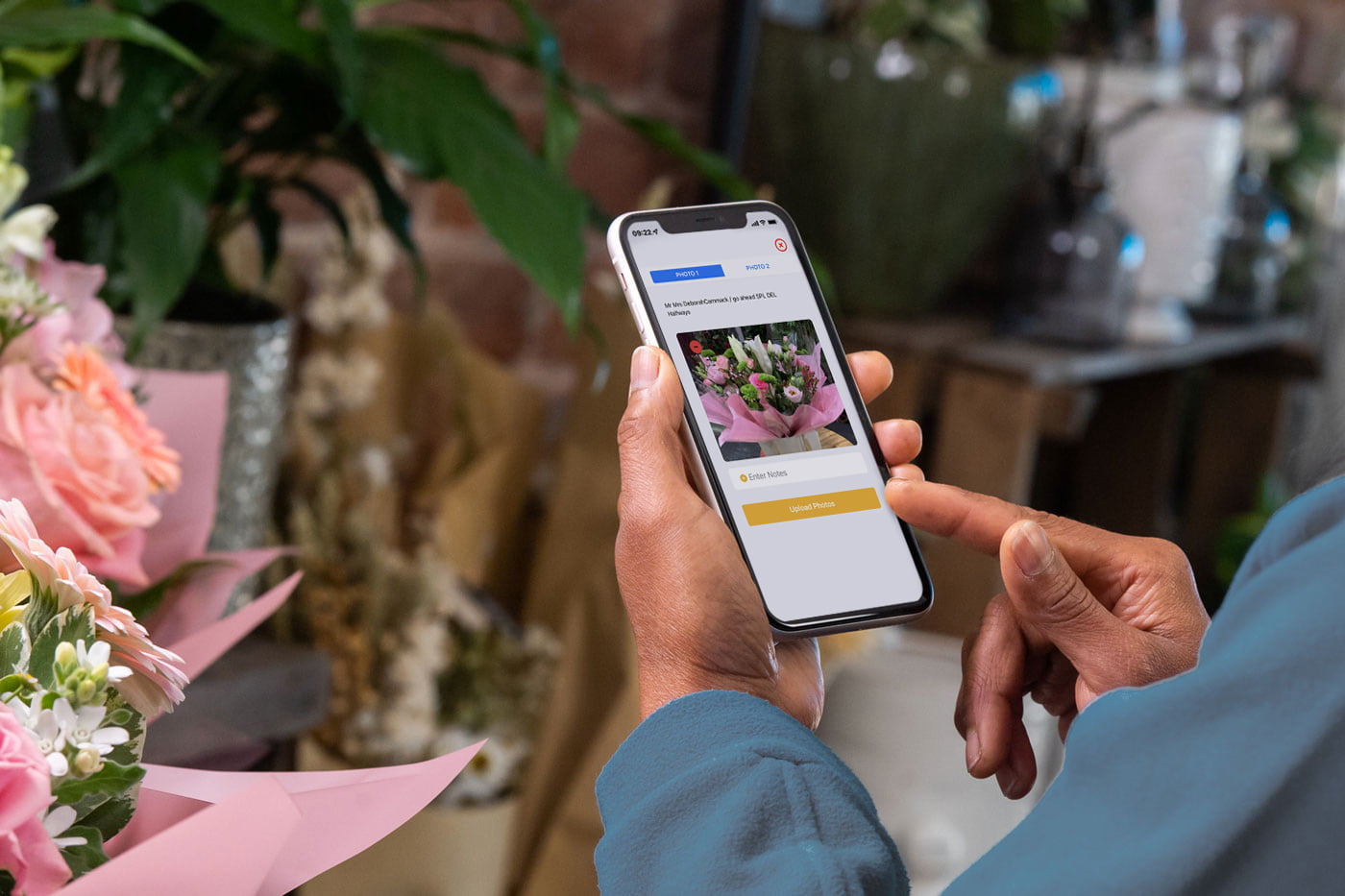 Florist taking and uploading a product via the app