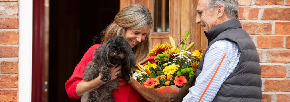 Beautiful autumn flowers in warm orange, golden yellow and rich red shades, celebrating the colours of the season.